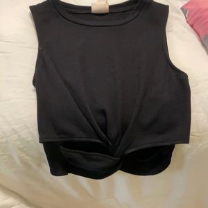 Never worn black tank with cutouts.